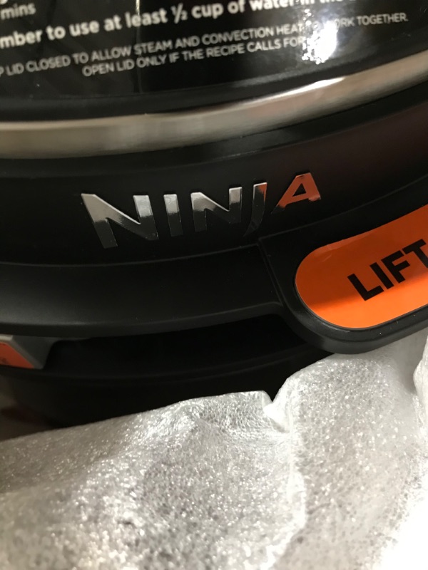 Photo 1 of Ninja OL501 Foodi 6.5 Qt. 14-in-1 Pressure Cooker Steam Fryer with SmartLid, that Air Fries, Proofs & More, with 2-Layer Capacity, 4.6 Qt. Crisp Plate & 25 Recipes, Silver/Black
