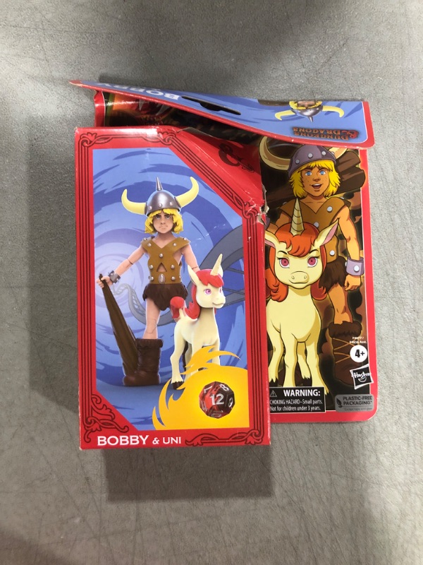 Photo 2 of Dungeons & Dragons Cartoon Classics 6-Inch-Scale Bobby & Uni 2-Pack Action Figures, D&D 80s Cartoon, Includes d12 from Exclusive D&D Dice Set