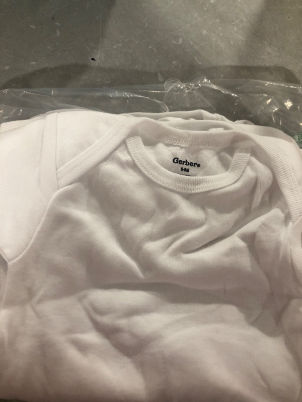 Photo 1 of BABY WHITE ONESIES
SIZE 6-9MONS