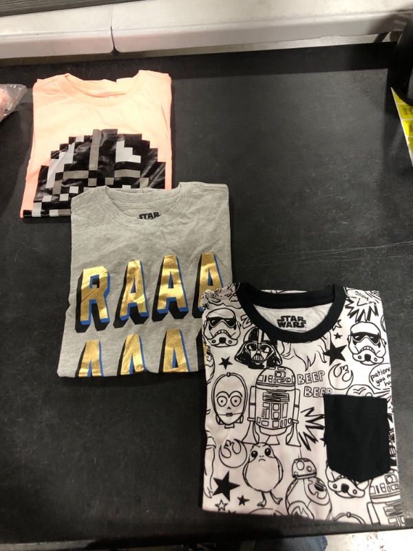 Photo 1 of Amazon Essentials Disney | Marvel | Star Wars | Frozen Boys and Toddlers' Short-Sleeve T-Shirts (Previously Spotted Zebra) 3 White/Grey/Orange/Star Wars/Doodles Small