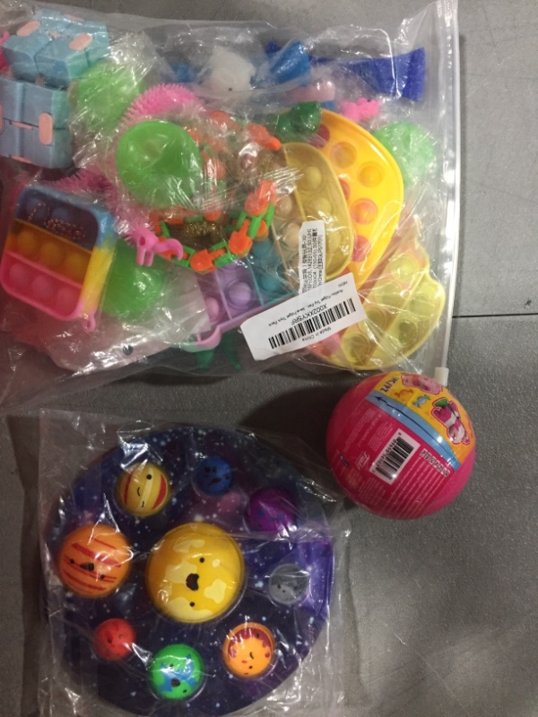 Photo 2 of BOX LOT- SOLD AS IS- FIDGET TOYS  AND TOYS 