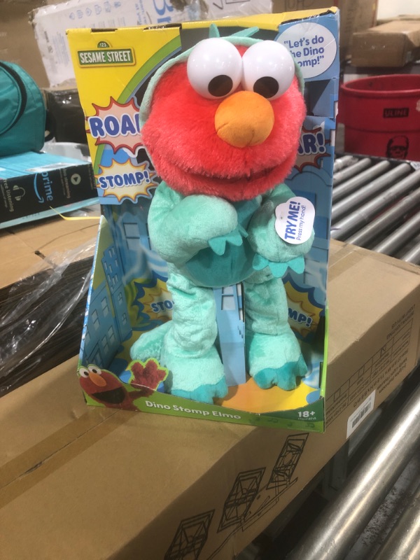 Photo 1 of Sesame Street Dino Stomp Elmo 13-Inch Plush Stuffed Animal Sings and Dances, Officially Licensed Kids Toys for Ages 18 Month, Gifts and Presents by Just Play