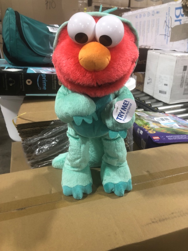 Photo 1 of Sesame Street Dino Stomp Elmo 13-Inch Plush Stuffed Animal Sings and Dances, Officially Licensed Kids Toys for Ages 18 Month, Gifts and Presents by Just Play