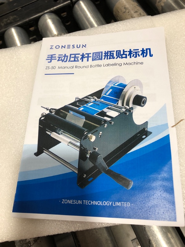 Photo 3 of ZONEPACK Manual Round Labeling Machine with Handle Manual Round Bottle Labeler Label Applicator for Glass Metal Bottle MT-30 Manual Labeling Machine