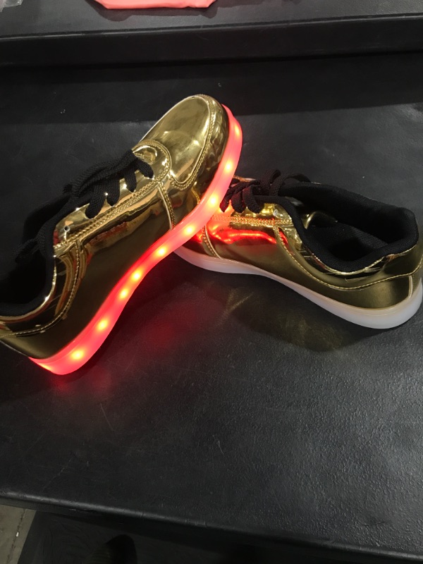 Photo 2 of 10.5 Gold shoes with lights in soles.