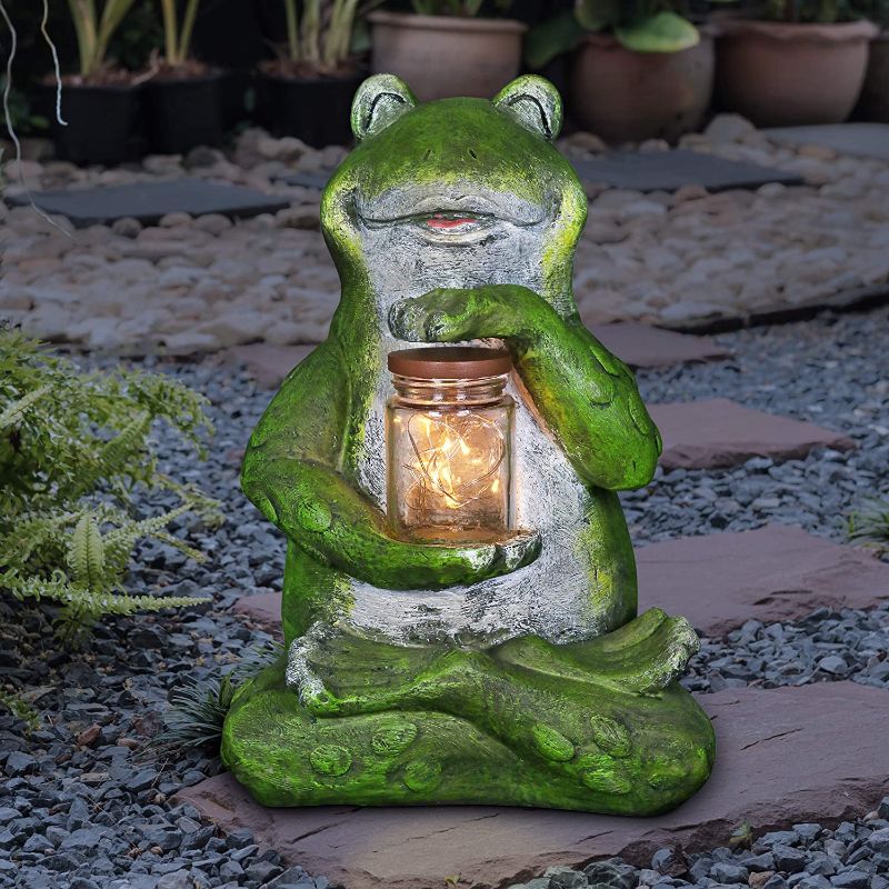 Photo 1 of Exhart Garden Sculpture, Frog Solar Garden Statue with Glass Jar, 8 LED Firefly Lights, Outdoor Garden Decoration, 7 x 6 x 11 Inch 