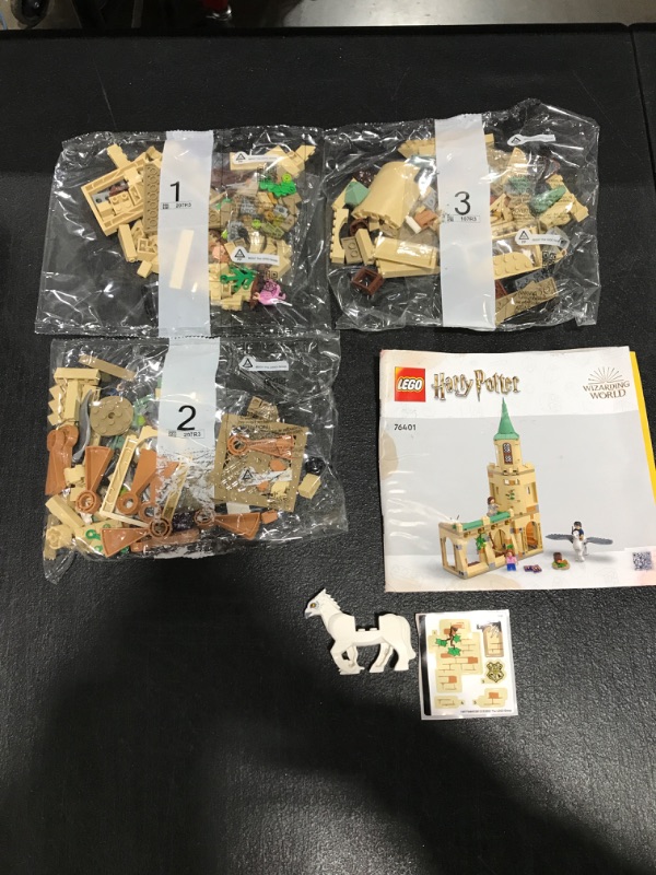 View 2 of LEGO Harry Potter Hogwarts Courtyard: Sirius’s Rescue 76401 Building Toy Set from Prisoner of Azkaban Movie Featuring Hermione Granger and Sirius Black for Kids, Girls, and Boys Ages 8+ (345 Pieces). BOX WAS WATER DAMAGED. MINOR DAMAGE TO INSTRUCTION BOOK