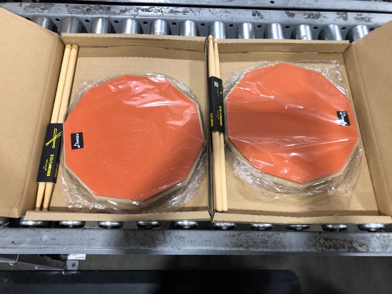 Photo 1 of 2 pack - Donner 12 Inches Drum Practice Pad Silent Drum Pad Set orange 2-Sided With Drum Sticks
