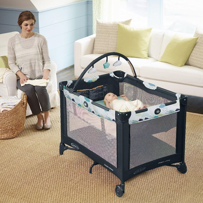 Photo 1 of Graco Pack and Play On the Go Playard | Includes Full-Size Infant Bassinet, Push Button Compact Fold, Stratus , 39.5x28.25x29 Inch (Pack of 1)
