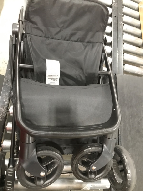 Photo 1 of generic white and black stroller