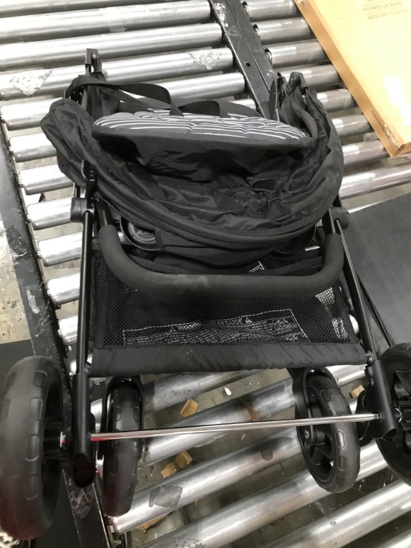 Photo 2 of generic white and black stroller