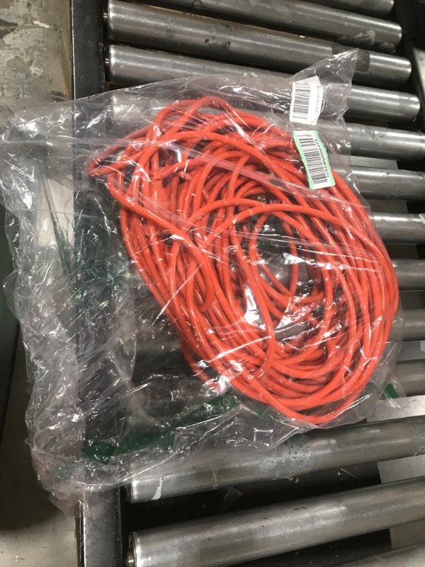 Photo 2 of Amazon Basics 100-Foot 3-Prong Vinyl Indoor/Outdoor Extension Cord - 10 Amps, 1250 Watts, 125 VAC - Orange
