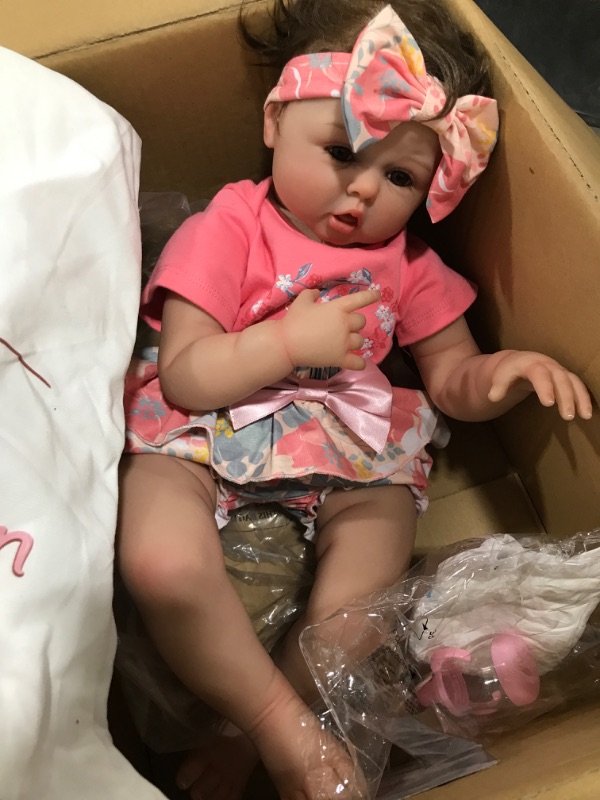 Photo 1 of Aori Reborn Baby Dolls 22 Inch Realistic Lifelike Girl Dolls in Soft Vinly and Weighted Soft Body with Pink Deer Clothes and Doll Accessories Set
