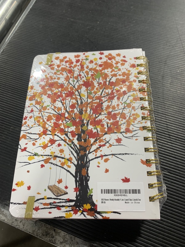 Photo 2 of Ymumuda 2023 Planner, Weekly Monthly Planner 2023, 12-Month School Planner from JAN.2023 to DEC.2023, 8.4" X 6", Spiral Planner Notebook with Stickers, Elastic Closure, Inner Pocket, Coated Tabs, Colorful Tree Colorful Maple