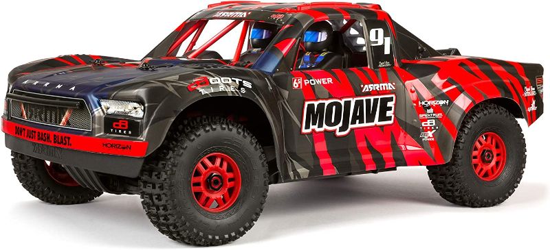 Photo 1 of ARRMA RC Truck 1/7 Mojave 6S V2 4WD BLX Desert Truck with Spektrum Firma (Ready-to-Run), Red/Black
(NOT FUNCTIONAL PARTS ONLY AND MISSING MULTIPLE PIECES BODY COVER AND BATTERY)