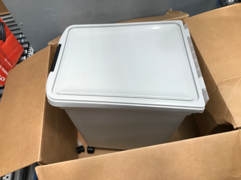 Photo 4 of *** USED *** ** HAS SMALL HOLE IN THE BOTTOM WHERE ONE OF THE WHEELS GO ** IRIS USA 50 Lbs / 65 Qt WeatherPro Airtight Pet Food Storage Container with Removable Casters, for Dog Cat Bird and other Pet Food Storage Bin, Keep Fresh, Translucent Body, Easy M
