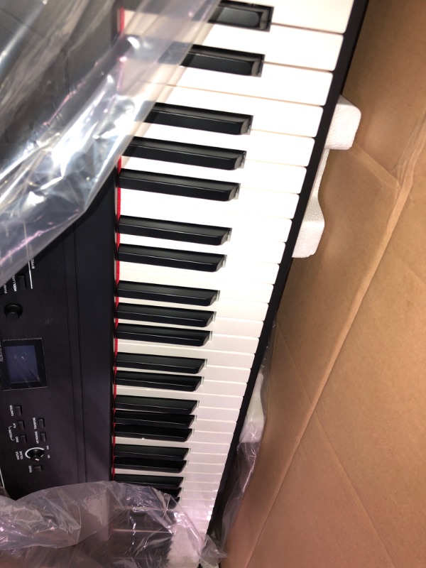 Photo 2 of **PREVIOUSLY OWNED; SEE NOTES** Electric Keyboard with 88 Weighted Keys, Built-In Speakers, 12 Voices and Sustain Pedal 