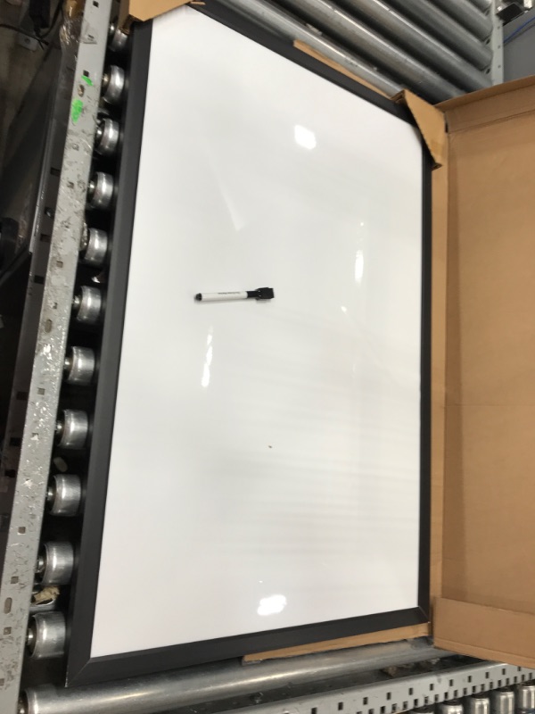 Photo 2 of Amazon Basics Magnetic Dry Erase White Board, 35 x 23-Inch Whiteboard - Black Wooden Frame 23"x35" Magnetic, Wood Frame