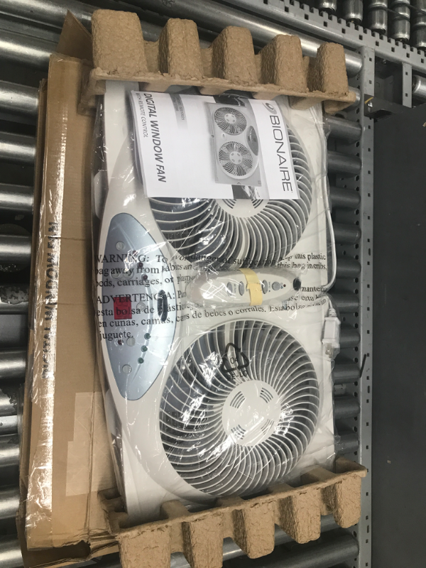 Photo 2 of ***TESTED/ POWERS ON***Bionaire Window Fan with Twin 8.5-Inch Reversible Airflow Blades and Remote Control, White White 2 Blades Electronic control with LCD screen Window Fan