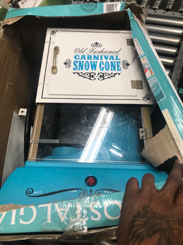 Photo 2 of ***TESTED/ POWERS ON***Nostalgia Snow Cone Cart, 48-Inch, Makes 48 ICY Treats, Vintage Snow Machine Includes Metal Scoop, Storage Compartment, Wheels for Easy Mobility, White/Blue