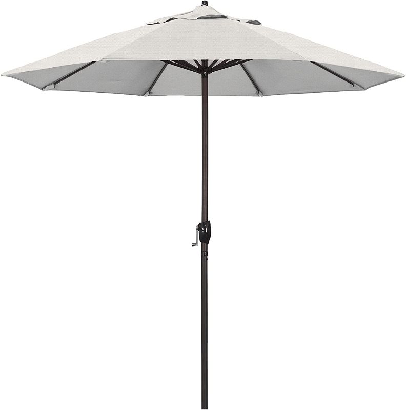 Photo 1 of **MINOR WEAR & TEAR**California Umbrella ATA908117-F77 Patio Umbrella, 9' Round, Woven Granite
