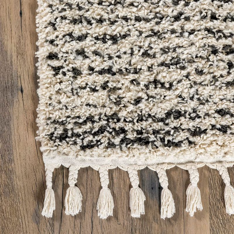 Photo 1 of **MINOR WEAR & TEAR**nuLOOM Sadie Moroccan Diamond Tassel Shag Area Rug, 4' x 6', Off-white
