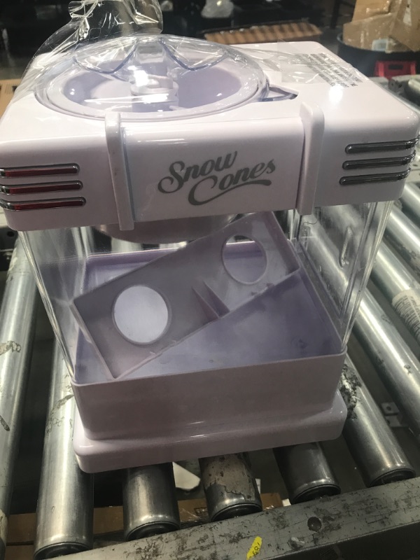 Photo 2 of **SEE NOTES**
Nostalgia Snow Cone Shaved Ice Machine - Retro Table-Top Slushie Machine Makes 20 Icy Treats - Includes 2 Reusable Plastic Cups & Ice Scoop - White
