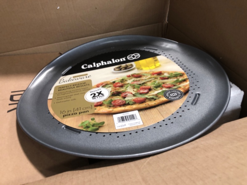 Photo 2 of **UNIT SLIGHTLY BENT** Calphalon Pizza Pan with Holes, 16-Inch Nonstick Round Pizza Crisper, Dishwasher Safe, Silver