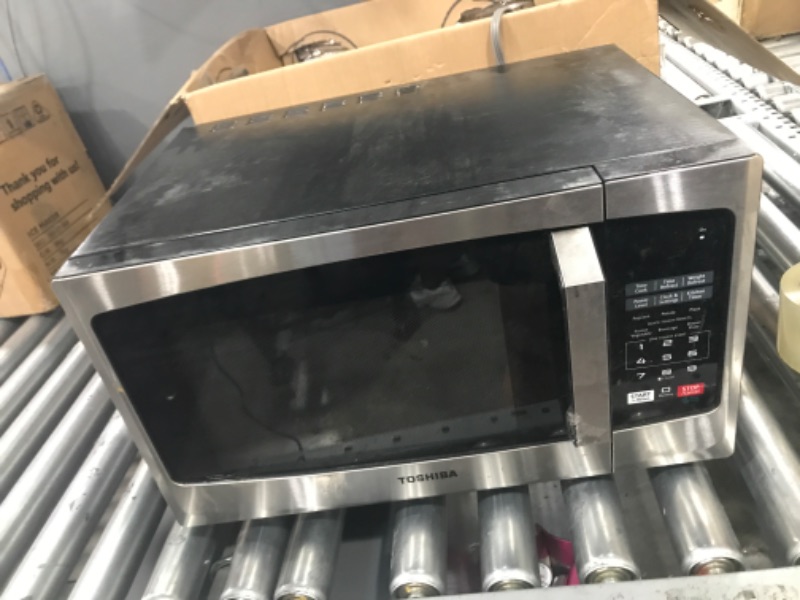 Photo 2 of **USED**
TOSHIBA EM925A5A-SS Countertop Microwave Oven, 0.9 Cu Ft With 10.6 Inch Removable Turntable, 900W, 6 Auto Menus, Mute Function & ECO Mode, Child Lock, LED Lighting, Stainless Steel