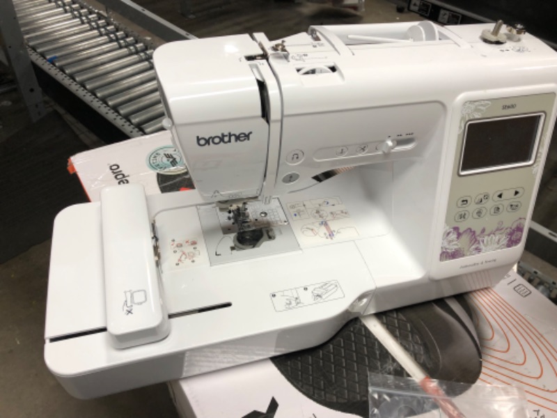 Photo 2 of **SEE NOTES**
Brother SE600 Sewing and Embroidery Machine, 4" x 4" Hoop Area, 3.2" LCD Touchscreen Display, 7 Included Feet