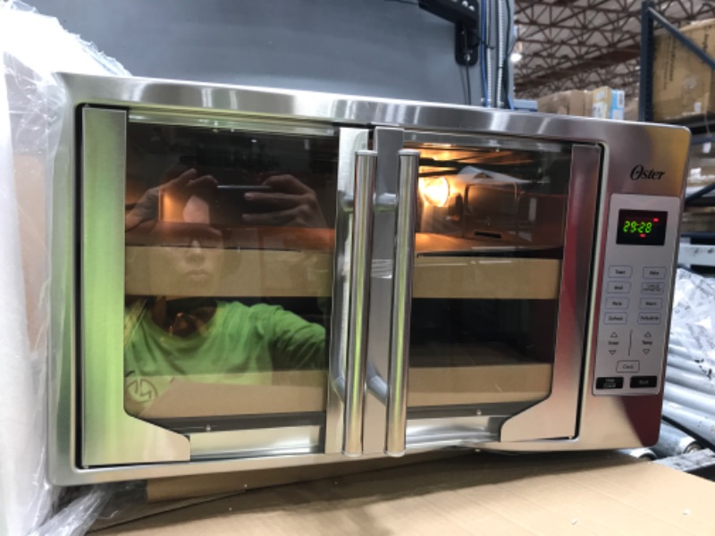 Photo 2 of **BOTTOM RIGHT SIDE OF TOASTER OVEN IS DENTED , SEE PHOTO***
Oster Convection Oven, 8-in-1 Countertop Toaster Oven, XL Fits 2 16" Pizzas, Stainless Steel French Door