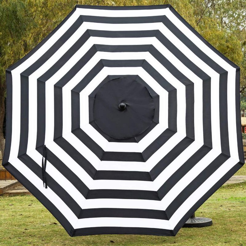 Photo 1 of **TOP OF UMBRELLA IS BROKEN , SEE PHOTO***
Sunnyglade 9' Patio Umbrella Outdoor Table Umbrella with 8 Sturdy Ribs (Black and White)
