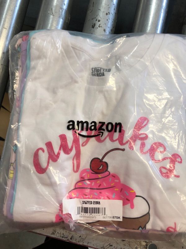 Photo 2 of Amazon Essentials Girls and Toddlers' Short-Sleeve T-Shirt Tops (Previously Spotted Zebra), Multipacks 4 Purple/Blue/White, Cupcake/Unicorn MEDIUM