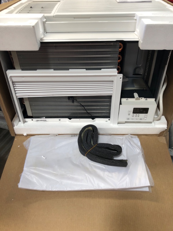 Photo 2 of **SEE NOTES**
LG 12,000 BTU Window Air Conditioner with Supplemental Heat, Cools 550 Sq.Ft. (22' x 25' Room Size), Electronic Controls with Remote, 2 Cooling, Heating & Fan Speeds, Slide In-Out Chassis, 230/208V
