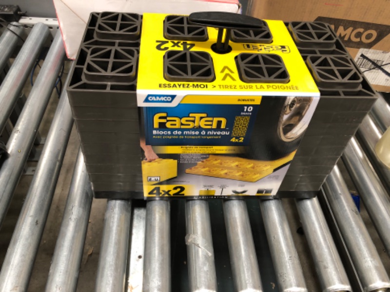 Photo 2 of Camco Patented FasTen Leveling Blocks for RVs, Interlocking RV Leveling Blocks 4 x 2, Pack of 10 (21023) Yellow Dual Tires Standard Packaging