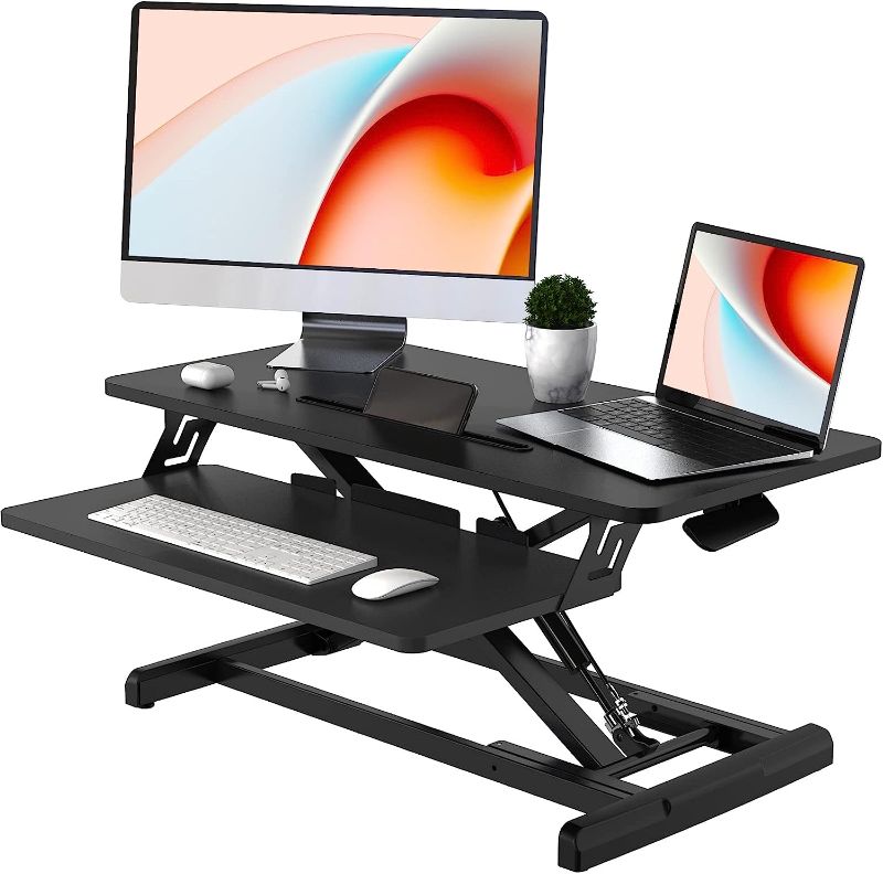 Photo 1 of JOY worker Standing Desk Converter, 32" Wide Height Adjustable Sit Stand Up Desk Riser with Keyboard Tray, Desktop Workstation Riser for Home Office Computer Laptop, Particle Board, Black