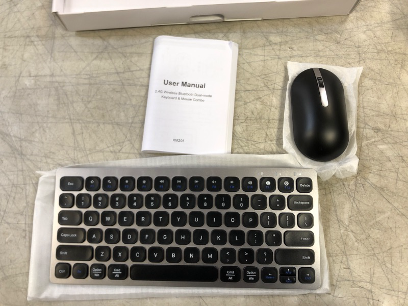 Photo 1 of BLUETOOTH COMPUTER KEY BOARD WITH MOUSE -LIGHT WEIGHT- SILVER 
