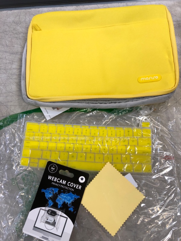 Photo 1 of LAPTOP CASE- YELLOW- WITH KEYBOARD STICKERS/ WEBCAM LENS COVER 
SIZE-14X10 INCHES