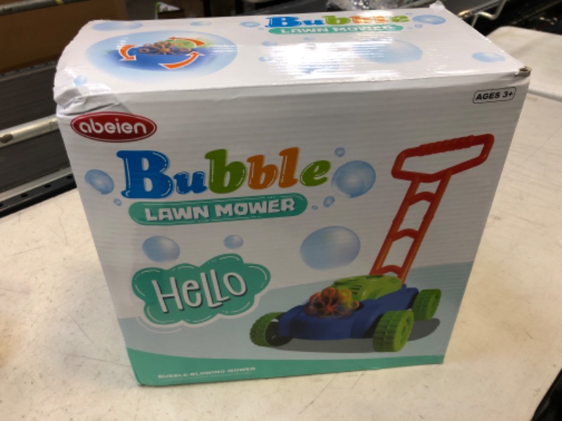 Photo 1 of kid's bubble lawn mower..