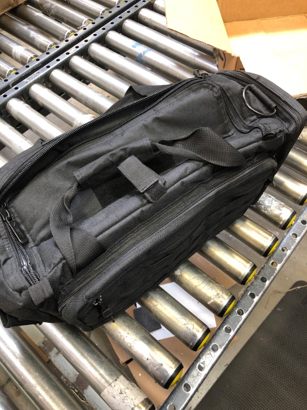 Photo 1 of black duffle bag