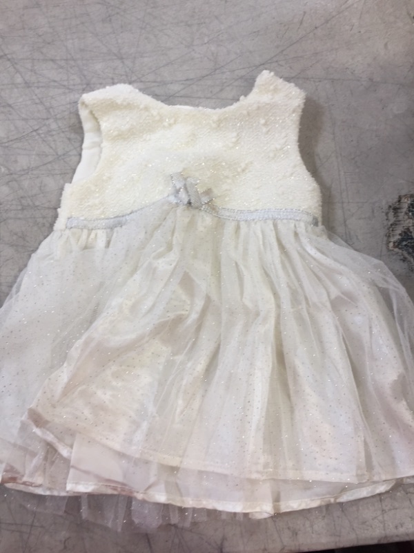 Photo 1 of BABY DRESS- WHITE
SIZE- 6-9 MONTHS