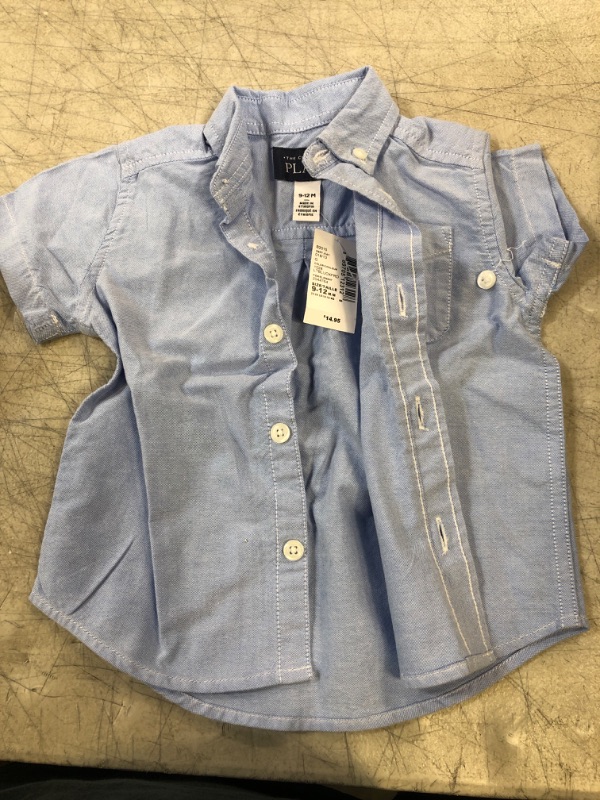 Photo 1 of BABY SHIT - BLUE BUTTON UP
SIZE- 9-12 MONTHS 