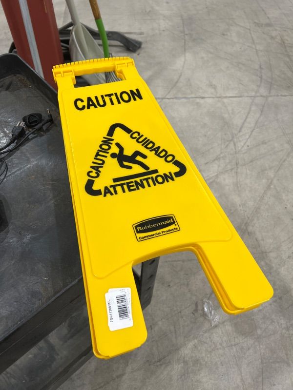 Photo 2 of Rubbermaid Commercial Products Multi-Lingual 2-Sided Caution Wet Floor Sign