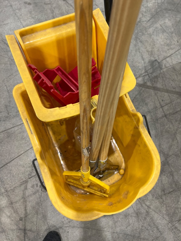 Photo 2 of rolling mop bucket with 3 mop handles 