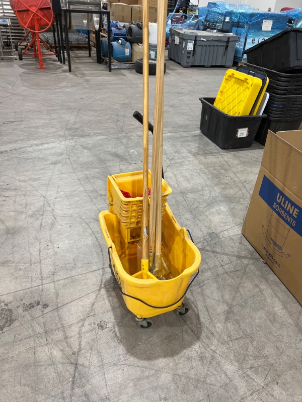 Photo 1 of rolling mop bucket with 3 mop handles 