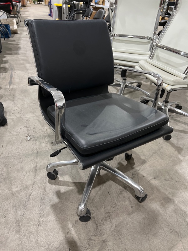 Photo 1 of black leather office chair