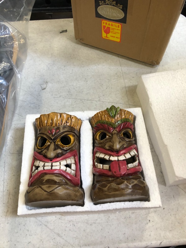 Photo 1 of 2 solar tiki faces lights