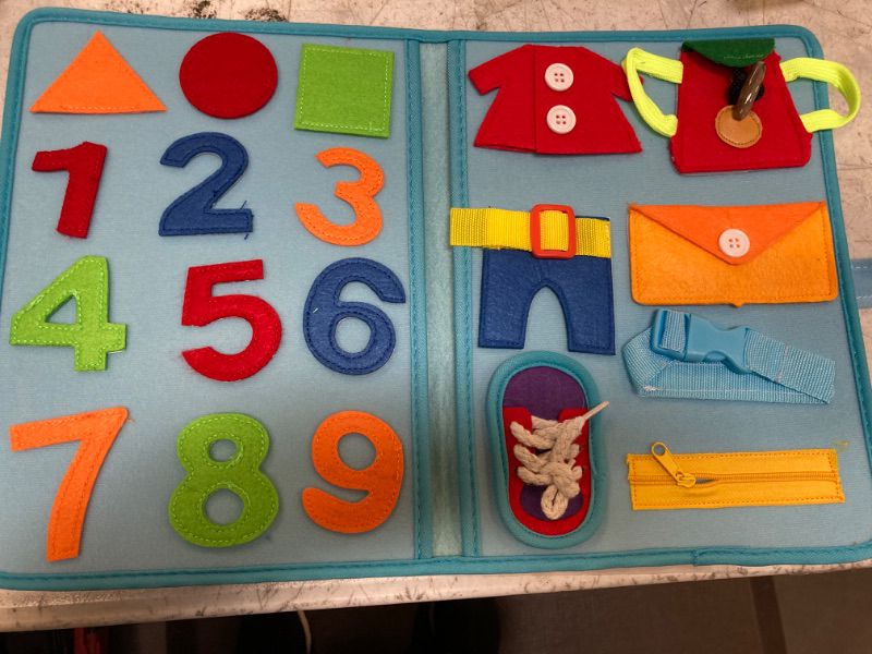 Photo 1 of COVTOY Busy Board Montessori for 1-2 Year Old, Developing Fine Motor Skills and Basic Skills,