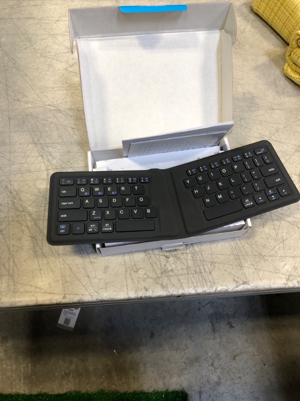 Photo 2 of Portable Keyboard, iClever BK06 Foldable Bluetooth Keyboard, Multi-Device Wireless Folding Keyboard, Ultra Slim Ergonomic Design with Stand Holder for iPhone, iPad, Smartphone, Tablet, Laptop