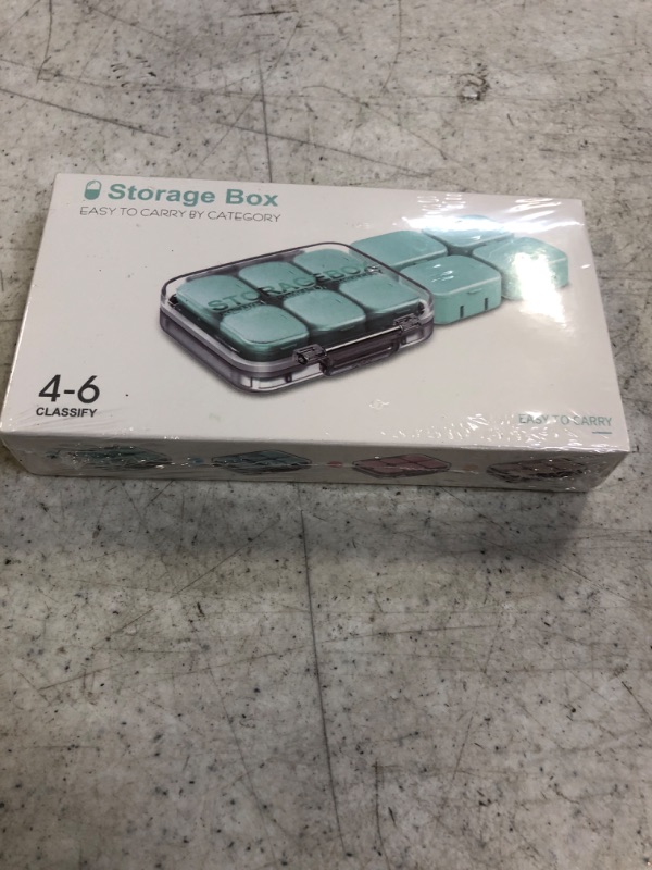 Photo 1 of AIKEFOO Pill Box 7 Days Travel Pill Box Drug Storage Box Weekly Pill Box (Green)